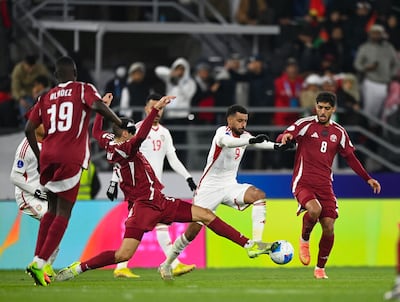 UAE striker Harib Abdalla takes on the Qatar midfield in the Arabian Gulf Cup. UAEFA