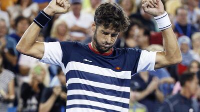 Feliciano Lopez reacts after beating Rafael Nadal 5-7, 6-4, 7-6 (7/3) on Thursday at the Cincinnati Masters. John Minchillo / AP