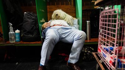One man and his dog rest on the first day of the Crufts show, at the National Exhibition Centre in Birmingham. PA