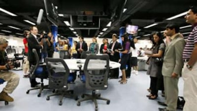 Members of Hydra Executives prepare to film an episode in the National newsroom.