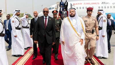 Qatar's Minister of State Mohammed Al Khulaifi, right, receives Sudan's army chief Gen Abdel Fattah Al Burhan in Doha. AFP / Qatar News Agency