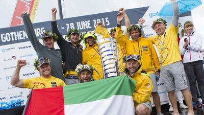 The Abu Dhabi Ocean Racing crew celebrate with the UAE flag and Volvo Ocean Race trophy at the round-the-world regatta's conclusion on Monday in Sweden. Ian Roman / Abu Dhabi Ocean Racing