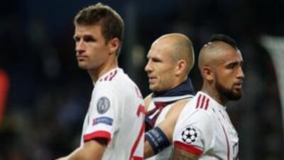 Bayern Munich's Thomas Muller, Arturo Vidal and Arjen Robben look dejected after the match against Paris St-Germain (REUTERS/Benoit Tessier)