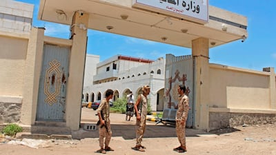 Fighters with Yemen's separatist Southern Transitional Council (STC) stand guard at the entrance of the Ministry of Finance's premises in the southern city of Aden, on April 26, 2020. AFP