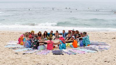 Prince Harry and Meghan talk to members of OneWave. Getty Images