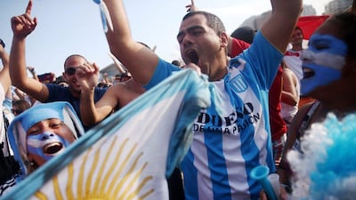 Argentina fans celebrate after Lionel Messi's winner against Iran on Saturday at the 2014 World Cup. Mario Tama / Getty Images / June 21, 2014
