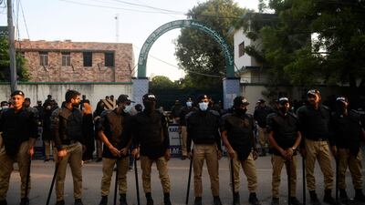 Policemen stand guard in Karachi during a protest by Pakistan Tehreek-e-Insaf activists against the disqualification of former prime minister Imran Khan. AFP