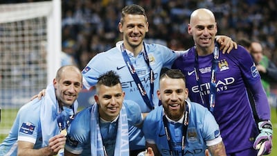 Manchester City's Pablo Zabaleta, Martin Demichelis, Sergio Aguero, Nicolas Otamendi and Wilfredo Caballero celebrate after the League Cup win over Liverpool. Reuters / Paul Childs