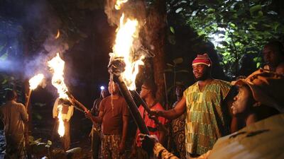 Actors hold flaming torches as they perform while filming ‘October 1’, a police thriller directed by Kunle Afolayan, at a rural location in Akure, southwest Nigeria.