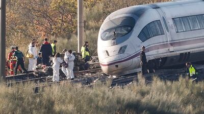Emergency crews work at the scene of a deadly collision between two trains near Urda, in Toledo province, central Spain. EPA