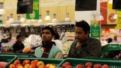 Men shop for produce in Doha. Qatar is among the countries looking to buy farmland in Africa.