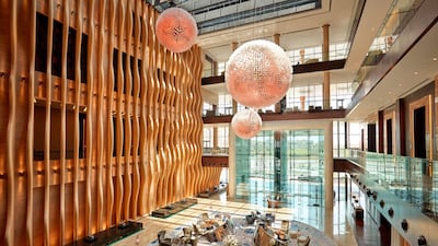 The lobby makes a statement with its feature wall and blingy design. Grand Hyatt Abu Dhabi
