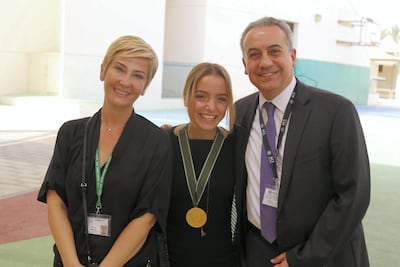 Elif and her family celebrate after receiving the Haitham Zamzam Al Hammadi Medal of International Friendship. American Community School of Abu Dhabi, May 2018