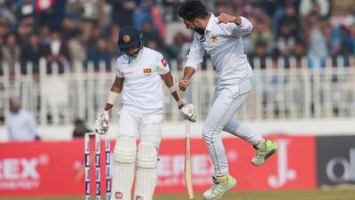 Pakistan's Usman Shinwari, right, celebrates after dismissing Kusal Mendis in Rawalpindi. AFP