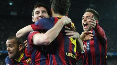 Barcelona celebrate with Lionel Messi, left, after his goal against Manchester City on Wednesday. Quique Garcia / AFP / March 12, 2014