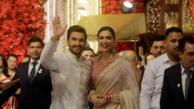 Bollywood actors Deepika Padukone and Ranveer Singh arrive to attend the wedding. AP Photo