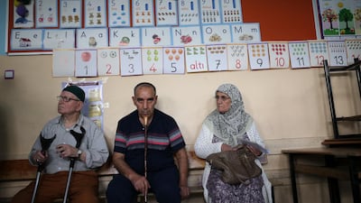 People wait to vote in Turkey's elections at a polling station in the mainly-Kurdish city of Diyarbakir, Turkey, on June 24, 2018. Emre Tazegul / AP Photo