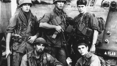 Top row from left, Charlie Sheen, Tom Berenger, Willem Dafoe, from bottom left, Francesco Quinn and Kevin Dillon in a scene from "Platoon."