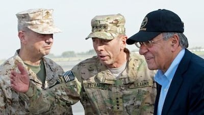 Gen John Allen (left) and Gen David Petraeus (centre) greet US secretary of defence Leon Panetta as he lands in Kabul.