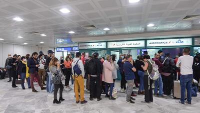 French tourists stranded at Tunis Carthage wait for flights to return to France. AFP