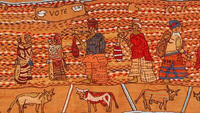 A panel urging women to vote.