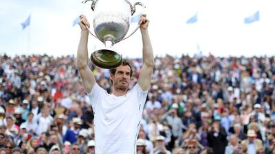 Any Murray lifts the trophy after beating Milos Raonic in the final of the Aegon Championships at Queens Club in London. Richard Heathcote / Getty Images