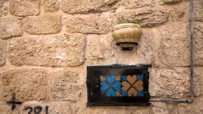A utility box on the old city wall that students have painted with hearts in blue and copper, turning an eyesore into a work of art. Heidi Levine for The National
