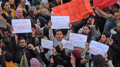 Tunisians take part in a rally marking the ninth anniversary of the 2011 uprising, at Habib Bourguiba Avenue in Tunis on January 14, 2020. AFP