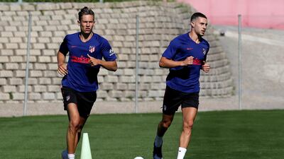Mario Hermoso (R) and Marcos Llorente (L) during a training session at Wanda Sport City. EPA