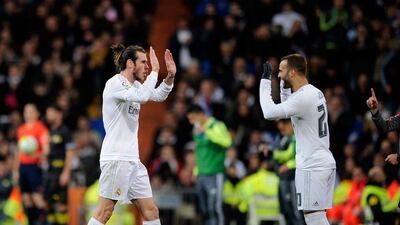 Gareth Bale of Real Madrid salutes Jesse Rodriguez on coming during the La Liga match between Real Madrid CF and Sevilla FC at Estadio Santiago Bernabeu on March 20, 2016 in Madrid, Spain. (Photo by Denis Doyle/Getty Images)