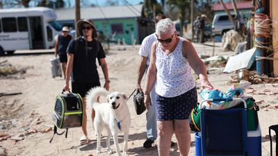Residents and their pets are being encouraged to leave because the only road on to the island is impassable. Getty / AFP