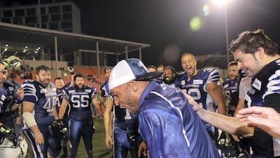Barracudas coach Zavier Cobb celebrates after winning the Desert Bowl. Chris Whiteoak / The National