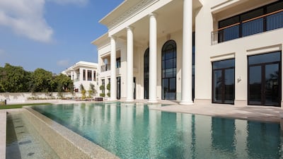 The pool is almost the same width as the house.