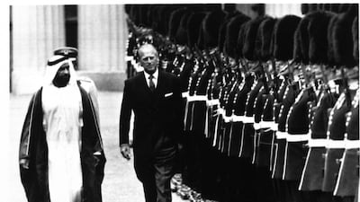 Sheikh Zayed and Prince Philip, the Duke of Edinburgh, review the Guard of Honour at Buckingham Palace in London, July 17, 1989. AP Photo