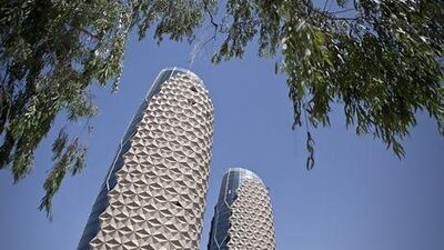 Al Bahar Towers use a solar shading system that features a computer-controlled facade which can either allow in or block off sunlight. Silvia Razgova / The National