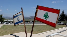 The Israeli and Lebanese flags at a monument called the 'Good Fence', in Metula, Israel. The Lebanese village of Al Khiam can be seen in the background next to the border. EPA