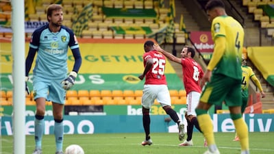 United's Odion Ighalo is congratulated by Juan Mata after scoring. AFP
