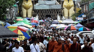 Supporters of ultra-nationalist monk Wirathu gather to pray at Shwedagon pagoda in Yangon. AFP