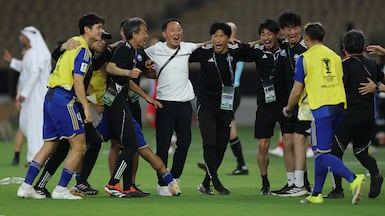 Machida Zelvia coach Go Kuroda, centre (white shirt), celebrates with players and staff members after the AFC Champions League semi-final win over Shabab Al Ahli. Getty Images
