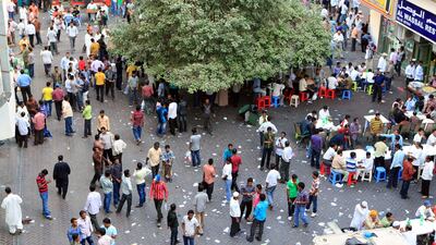 People gather behind Electra Street to celebrate the first day of Eid Al Adha in Abu Dhabi. Ravindranath K / The National