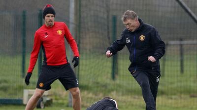 David Moyes is challenged by Wayne Rooney, ground, during Manchester United's training session on Tuesday. Phil Noble / Reuters / March 18, 2014