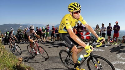 Chris Froome of Great Britain riding for Team Sky in the yellow leader's jersey rides in the peloton up the Lacets du Grand Colombier during Stage 15 of the 2016 Tour de France. Chris Graythen / Getty Images