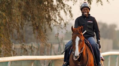 Dihigi Gladney exercising California Chrome at dawn at Meydan Racecourse, Dubai 3 Mar 2016 - Pic Steven Cargill / Racingfotos.com