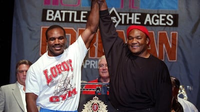 Evander Holyfield stands with George Foreman before the fight in Atlantic City, New Jersey. Getty