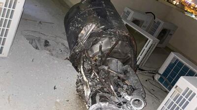 The remnants of a missile fired by Yemen's Houthi rebels, on a house rooftop in Saudi Arabia's capital Riyadh. SPA via AP