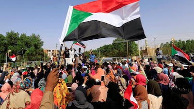 Sudanese civilians celebrate in Khartoum after protest leaders and the ruling military council reached an agreement to share power on July 5, 2019. Reuters
