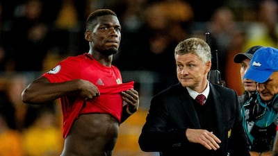 Pogba with Manchester United manager Ole Gunnar Solskjaer. EPA
