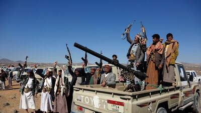 Armed Houthi fighters protest against US and British strikes on militia sites near Sanaa, Yemen, on Sunday. AP