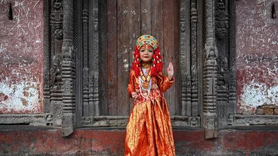 A girl dressed as the living goddess Kumari prepares for traditional rituals in Kathmandu, Nepal. AFP