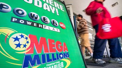 An advertisement for Mega Millions, a 44-state lottery with a record jackpot of nearly one billion US dollars, outside a grocery store in Washington. EPA